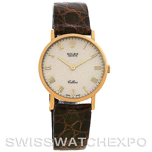 The Rolex Cellini 5112 Yellow Gold Beige Dial 5112 Yellow Gold Beige Dial watch is shown from a front angle, displaying the entire watch face, gold case, and brown leather strap.