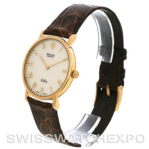 The image shows a Rolex Cellini 5112 Yellow Gold Beige Dial 5112 Yellow Gold Beige Dial watch at a 3/4 angle, displaying its face, crown, and brown leather strap.