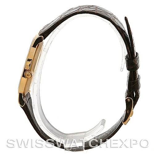 This image shows a Rolex Cellini 5112 Yellow Gold Beige Dial 5112 Yellow Gold Beige Dial watch from a side profile, highlighting the case, crown, and leather strap.