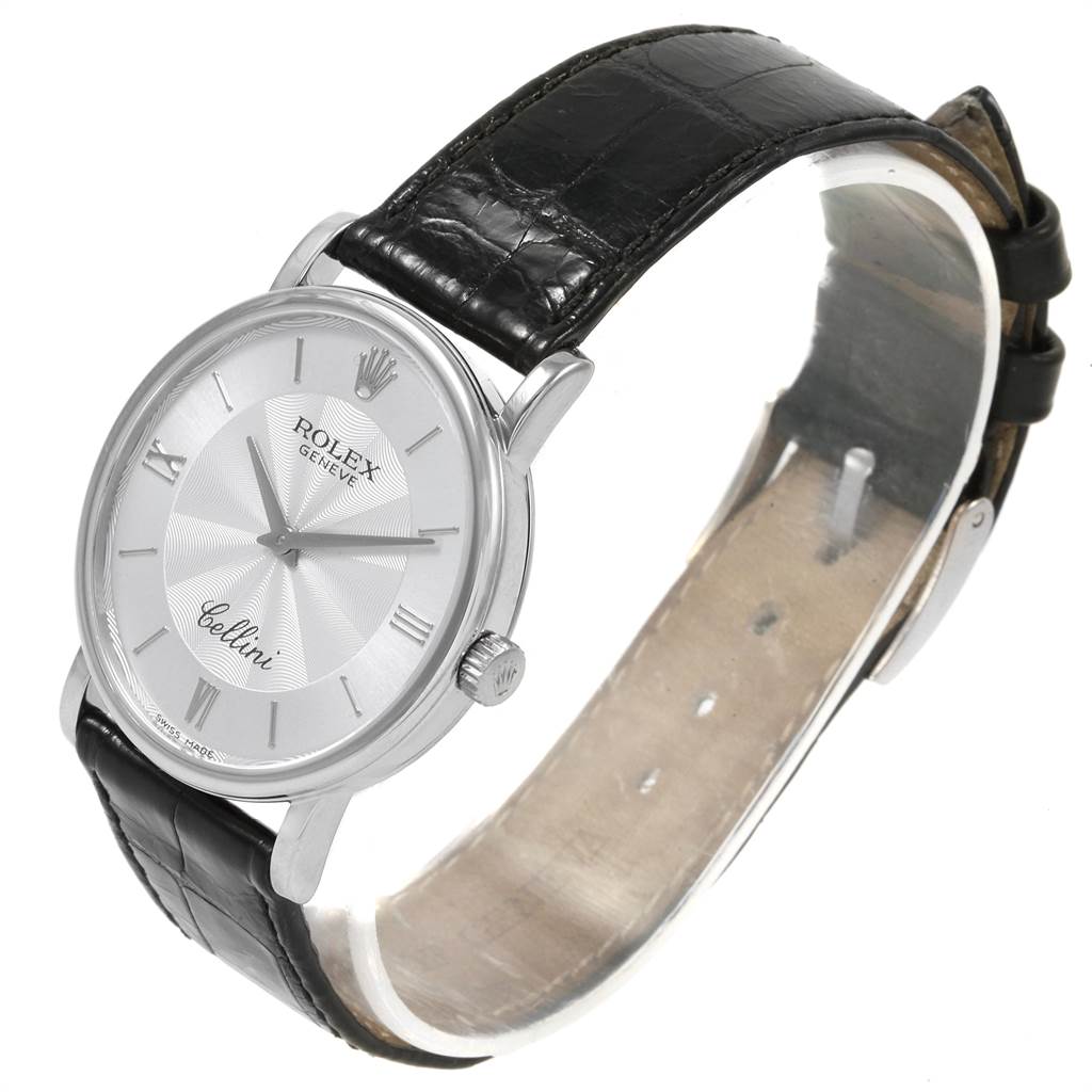 The image shows a Rolex Cellini 5115 Men's White Gold Silver Dial 5115 Men's White Gold Silver Dial watch at an angle, displaying its face, crown, and leather strap.