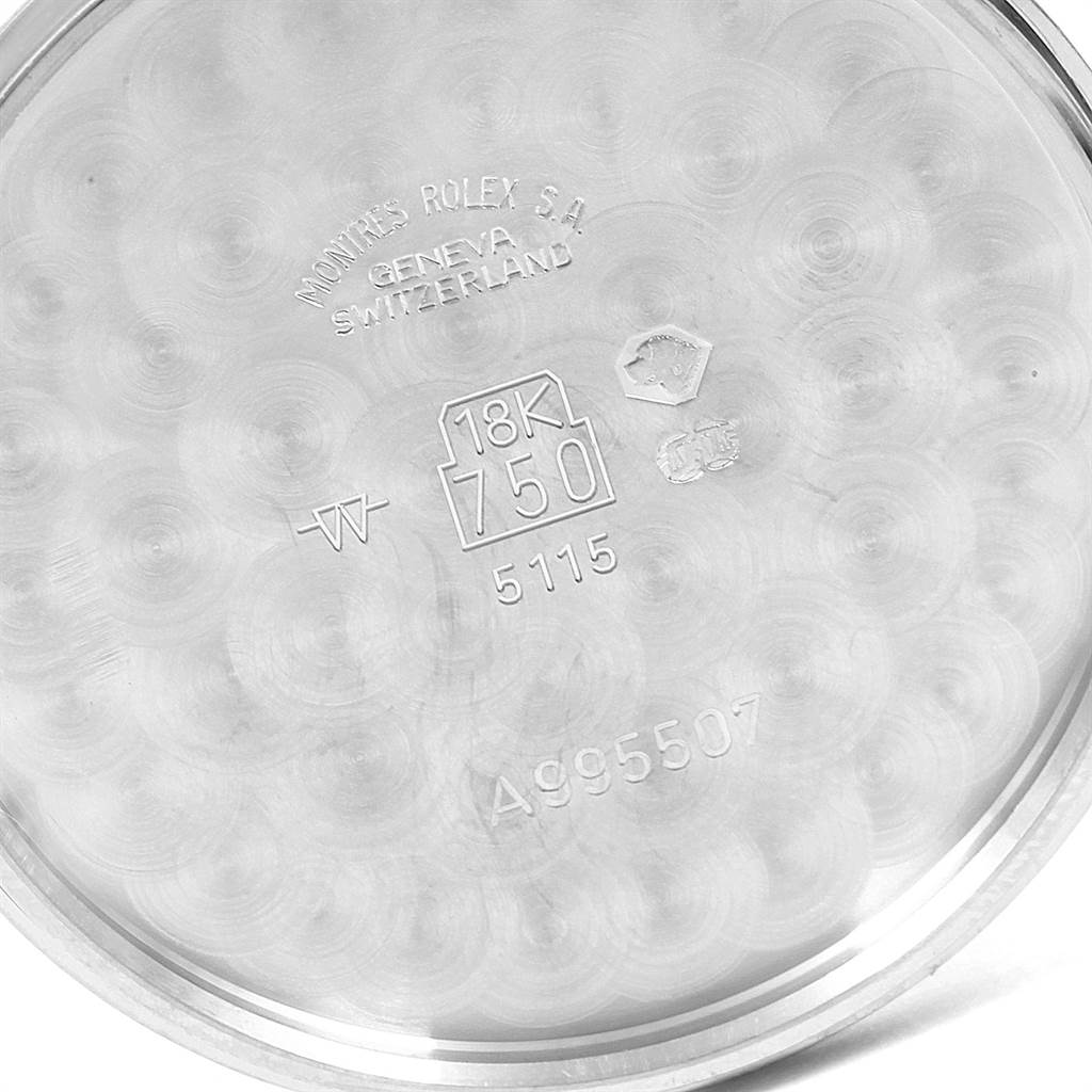 This image shows the inner case back of a Rolex Cellini 5115 Men's White Gold Silver Dial 5115 Men's White Gold Silver Dial model, featuring engravings and quality marks.