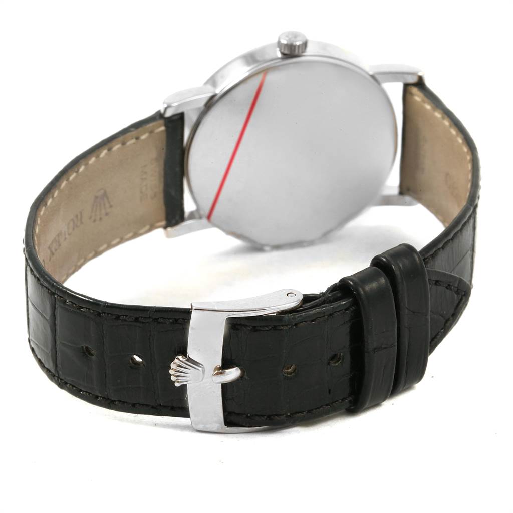 This image shows the back of the Rolex Cellini 5115 Men's White Gold Silver Dial 5115 Men's White Gold Silver Dial watch, highlighting its black leather strap and buckle with the Rolex logo.