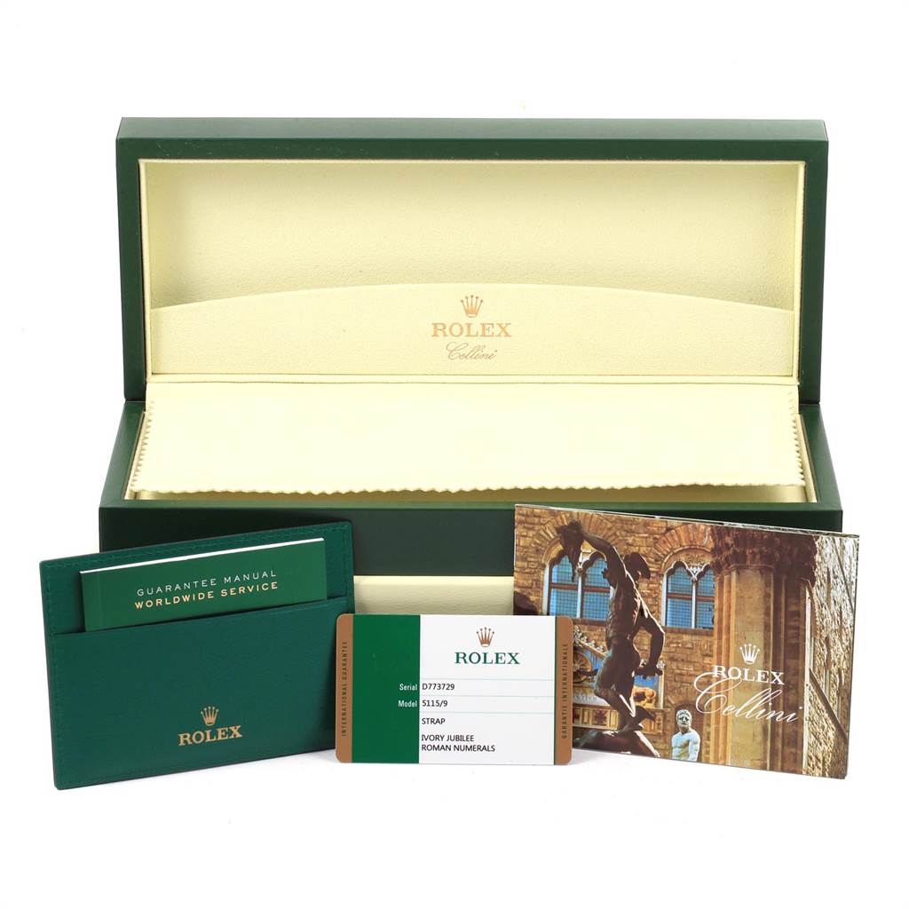 The image shows a Rolex Cellini 5115 Men's White Gold Silver Dial 5115 Men's White Gold Silver Dial watch box, a guarantee manual, a book, and a registration card placed in front of the box.