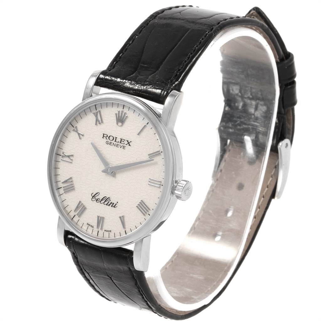 This image shows a Rolex Cellini 5115 Men's White Gold Silver Dial 5115 Men's White Gold Silver Dial watch with a white dial, Roman numerals, and a black leather strap viewed from a front-left angle.