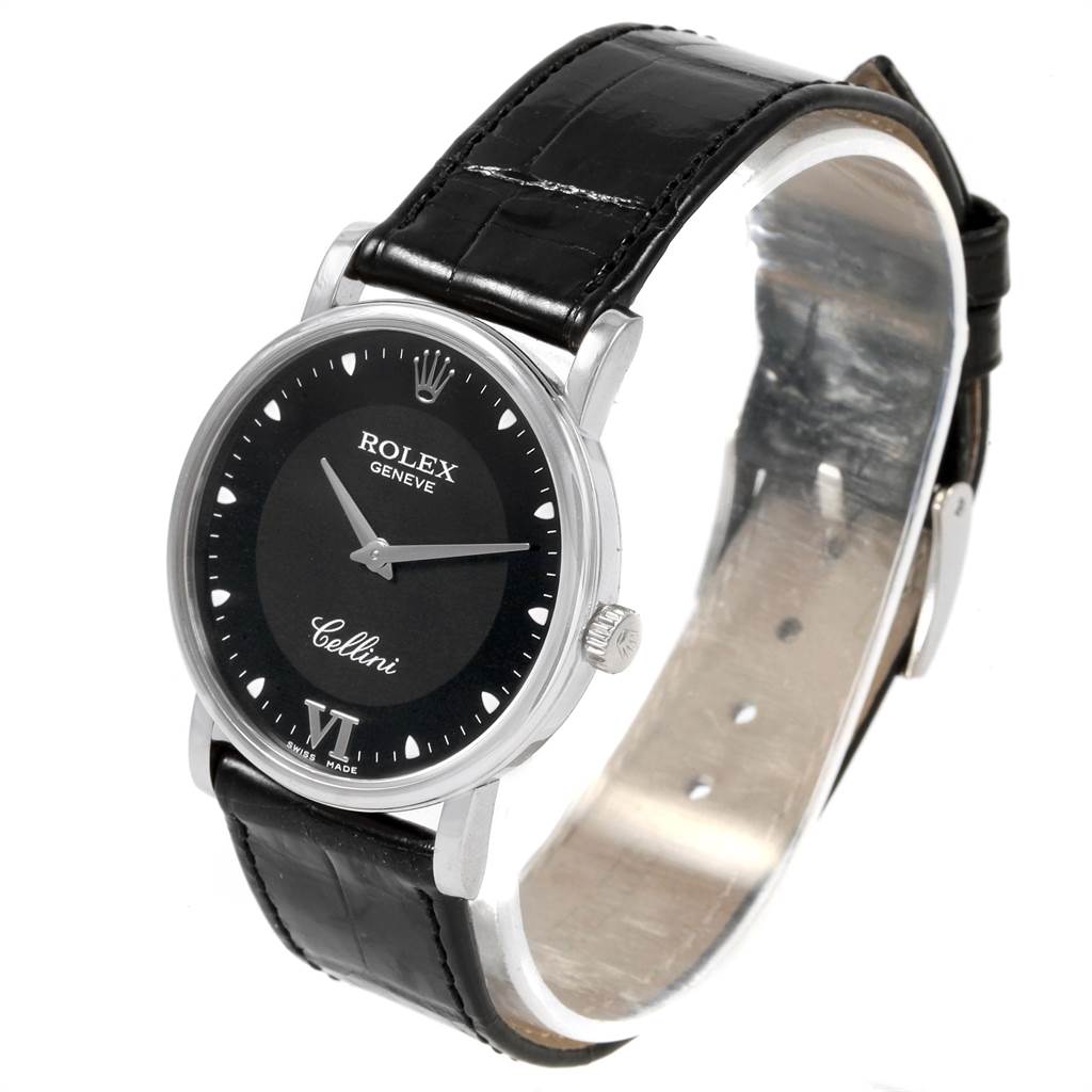 This image shows a Rolex Cellini 5115 Men's White Gold Black Dial 5115 Men's White Gold Black Dial watch from a front-side angle, displaying its black face, silver case, and black leather strap.