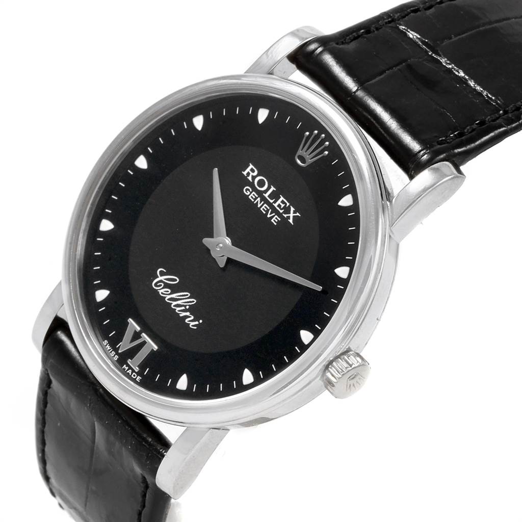 The Rolex Cellini 5115 Men's White Gold Black Dial 5115 Men's White Gold Black Dial watch is shown at an angle highlighting the face, crown, and black leather strap.