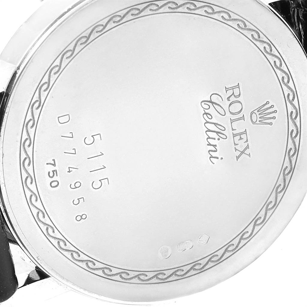 The image shows a close-up of the case back of a Rolex Cellini 5115 Men's White Gold Black Dial 5115 Men's White Gold Black Dial watch, featuring engravings and branding.