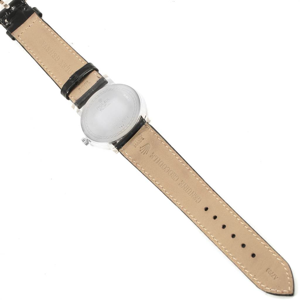 This image shows the back and straps of a Rolex Cellini 5115 Men's White Gold Black Dial 5115 Men's White Gold Black Dial watch laid flat.