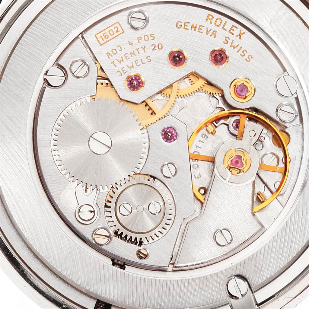 This is a close-up image showing the intricate inner mechanism and movement of a Rolex Cellini 5116 Men's White Gold Black Dial 5116 Men's White Gold Black Dial watch.