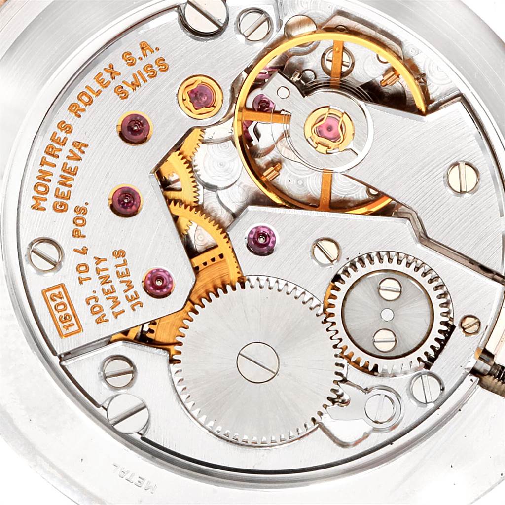 This is an internal close-up of the movement of a Rolex Cellini 5112 Men
s Yellow Gold Beige Dial 5112 Men
s Yellow Gold Beige Dial watch, showcasing its gears and mechanisms.