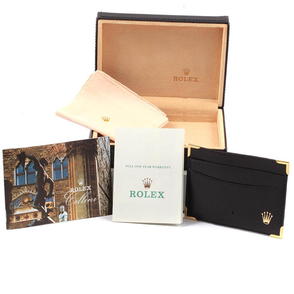 The image shows accessories for a Rolex Cellini 5112 Men
s Yellow Gold Beige Dial 5112 Men
s Yellow Gold Beige Dial watch, including a box, cleaning cloth, manual, warranty card, and a cardholder.