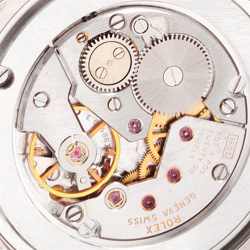 This image shows a close-up view of the intricate inner mechanism and gears of the Rolex Cellini 4233 White Gold Black Dial 4233 White Gold Black Dial watch.