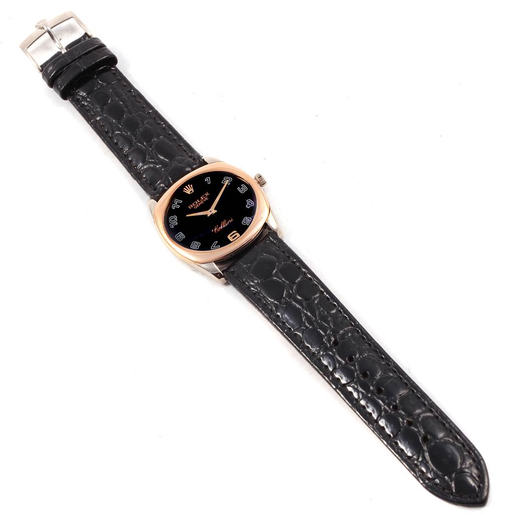 The image shows a Rolex Cellini 4233 White Gold Black Dial 4233 White Gold Black Dial watch from a top-down angle, highlighting its black leather strap and round dial.