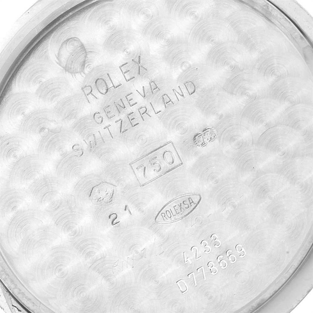 This image shows the inner casing back of a Rolex Cellini 4233 White Gold Black Dial 4233 White Gold Black Dial watch, featuring markings and inscriptions.