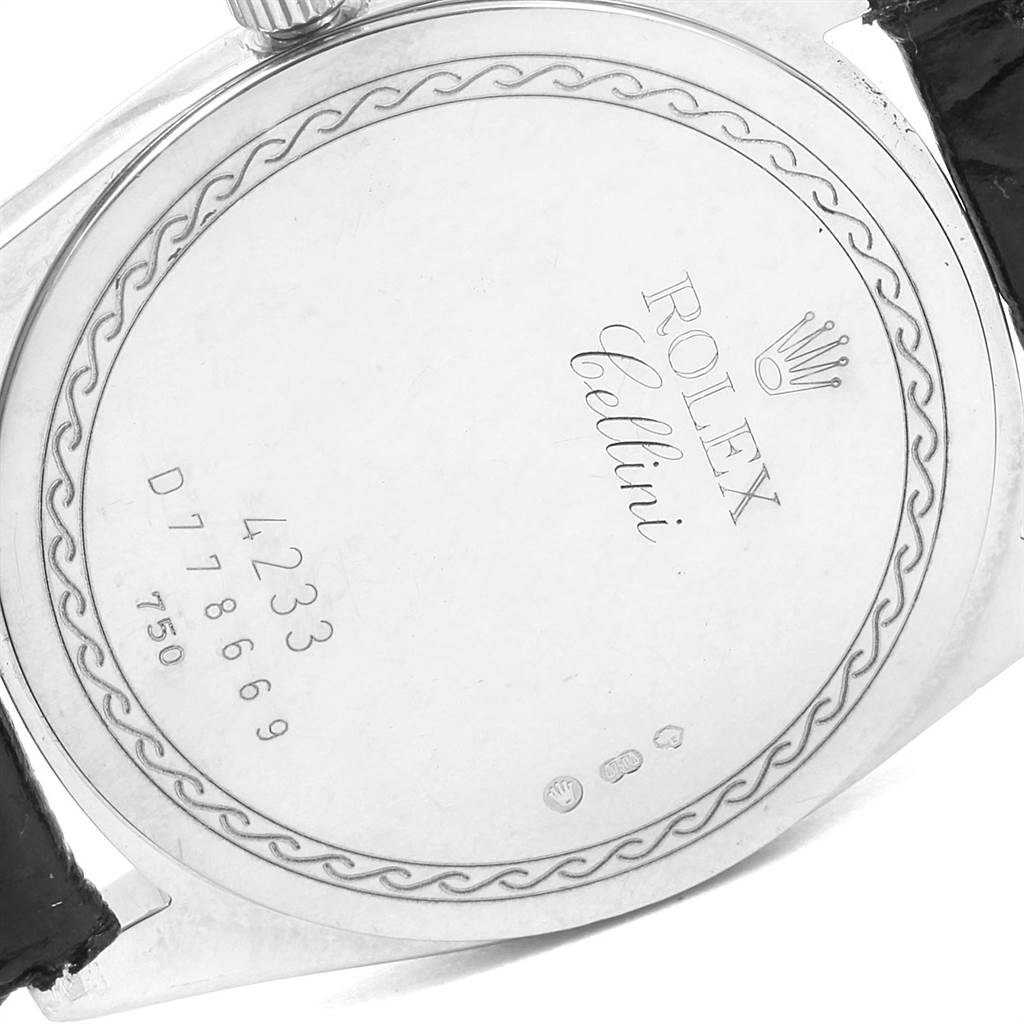 The image shows the back case of a Rolex Cellini 4233 White Gold Black Dial 4233 White Gold Black Dial watch, displaying its engravings and serial numbers.