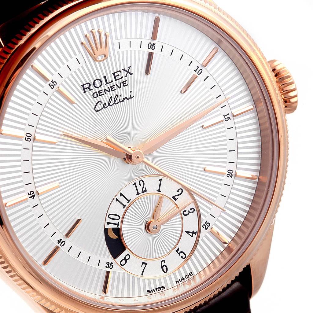 The image shows a close-up of the dial and bezel of a Rolex Cellini 50525 Men
s Rose Gold Silver Dial 50525 Men
s Rose Gold Silver Dial watch, highlighting its rose gold case and detailed face.