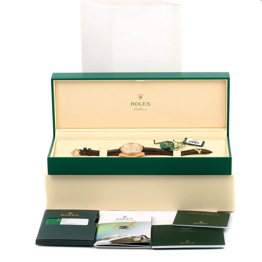 The image shows a Rolex Cellini 50525 Men
s Rose Gold Silver Dial 50525 Men
s Rose Gold Silver Dial watch inside its green box, alongside booklets and tags.