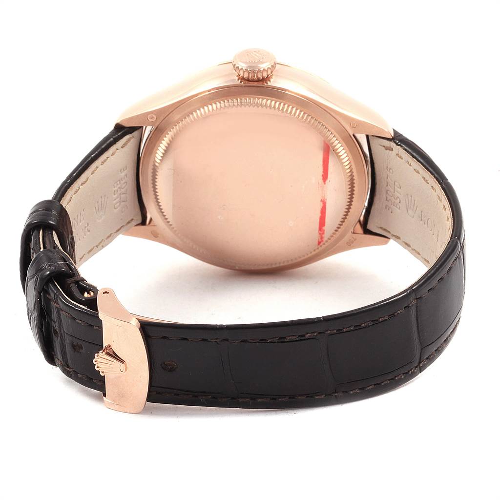 The image shows the back view of a Rolex Cellini 50525 Men's Rose Gold White Dial 50525 Men's Rose Gold White Dial watch, focusing on the case back, crown, and leather strap with the clasp.