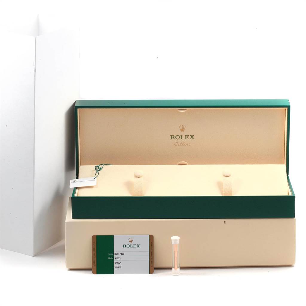 The image shows an open Rolex Cellini 50525 Men's Rose Gold White Dial 50525 Men's Rose Gold White Dial watch box with accompanying accessories, including a tag, warranty card, and a small vial.