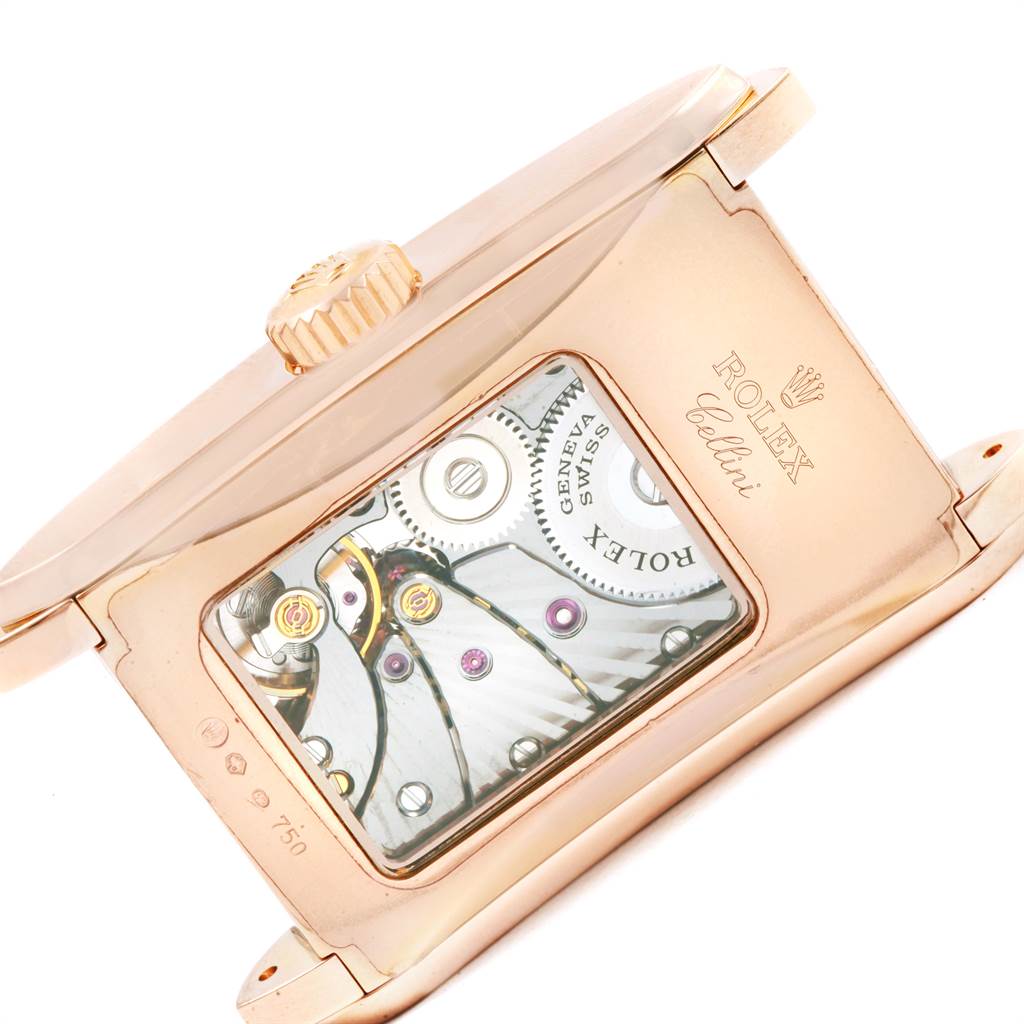 This image shows an angled side view of the Rolex Cellini 5442/5 Men's Rose Gold Black Dial 5442/5 Men's Rose Gold Black Dial watch, revealing its movement through a transparent case back.