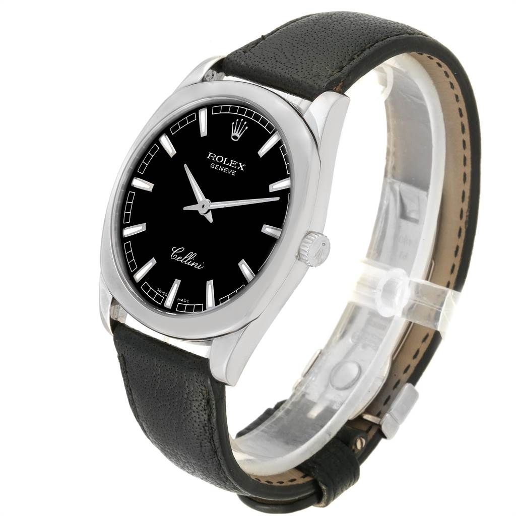 This image shows a side angle view of a Rolex Cellini 4243 Men's White Gold Black Dial 4243 Men's White Gold Black Dial watch featuring its black dial, silver indices, crown, and black leather strap.