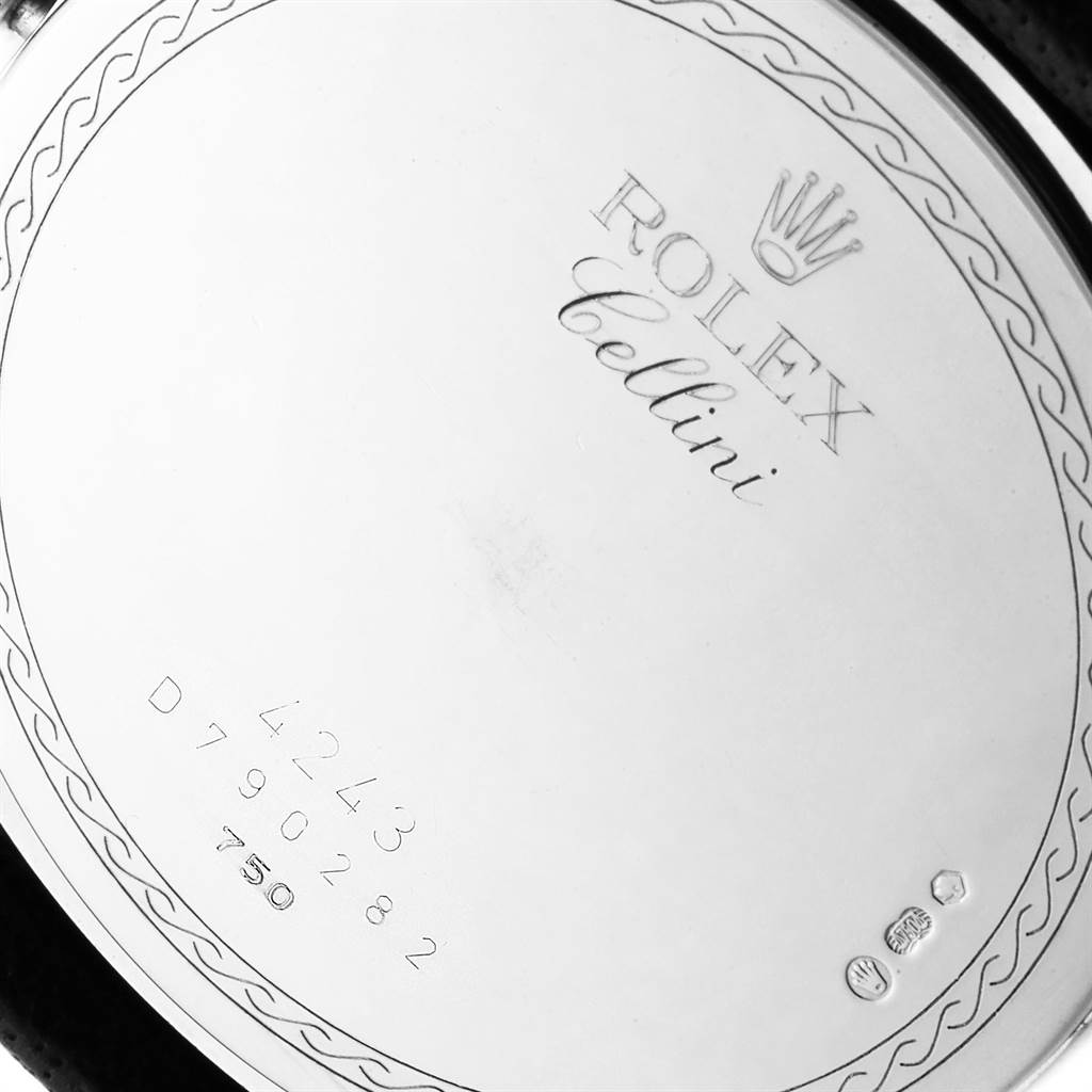 The image shows the back casing of a Rolex Cellini 4243 Men's White Gold Black Dial 4243 Men's White Gold Black Dial watch, including the model name, serial number, and hallmark engravings.