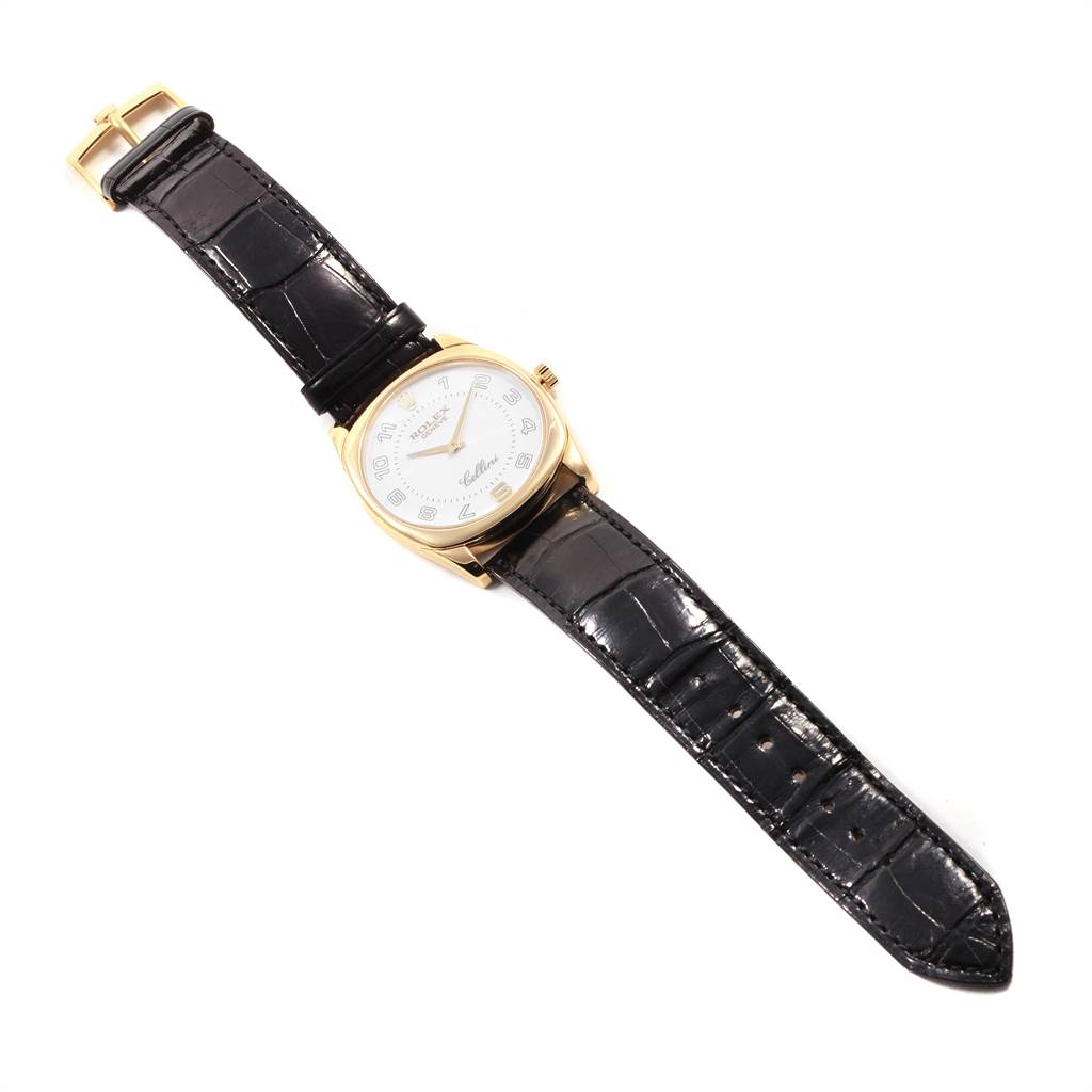 The Rolex Cellini 4233 Men's Yellow Gold White Dial 4233 Men's Yellow Gold White Dial watch is shown from a slightly angled top view, displaying the dial and black leather strap.
