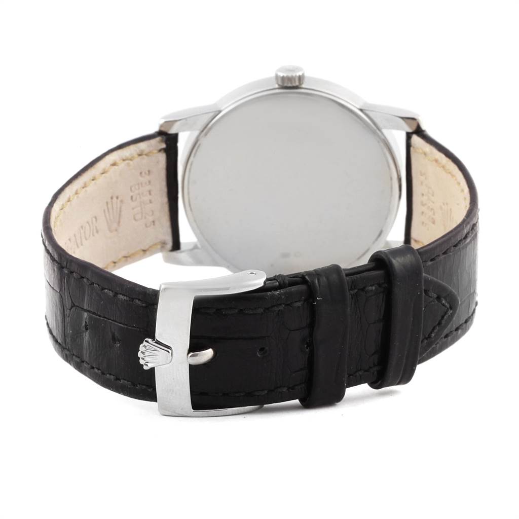 The image shows the back view of a Rolex Cellini 5116 Men's White Gold Black Dial 5116 Men's White Gold Black Dial watch, highlighting the leather strap and buckle.