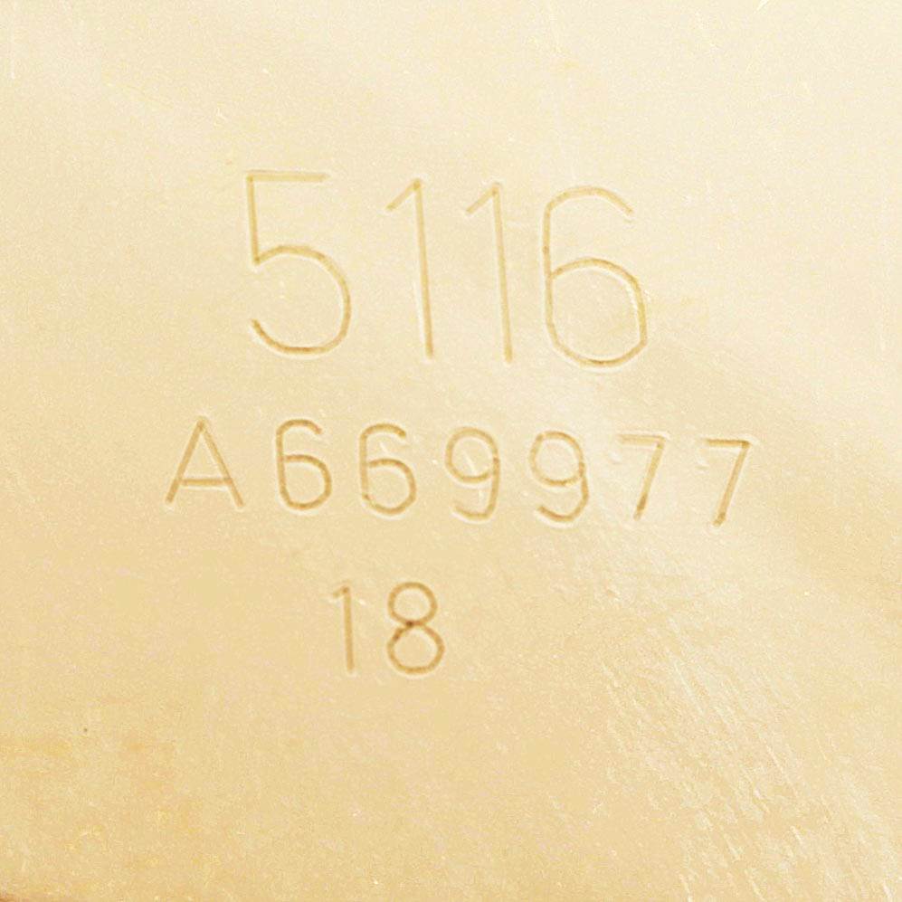 The image shows a close-up of the serial number and model number engraving on the back of a Rolex Cellini 5116 Men's Yellow Gold Grey Dial 5116 Men's Yellow Gold Grey Dial watch.