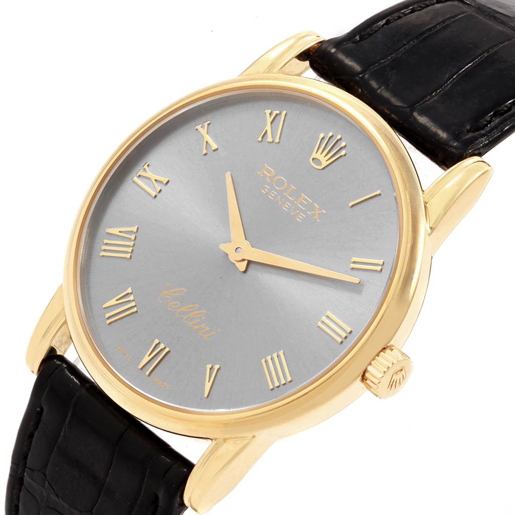 The Rolex Cellini 5116 Men's Yellow Gold Grey Dial 5116 Men's Yellow Gold Grey Dial watch is shown at a slight angle, highlighting the dial, case, crown, and part of the leather strap.
