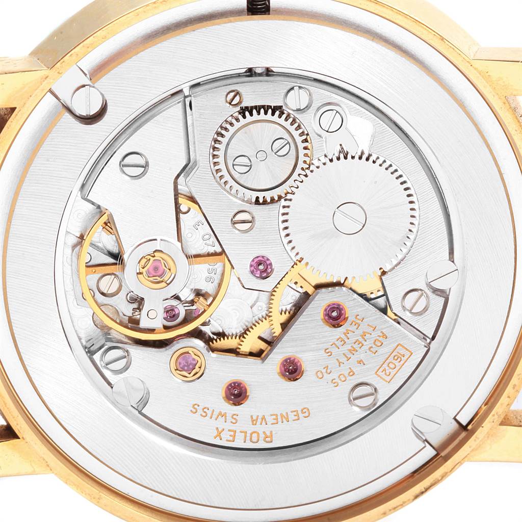 The image shows the intricate inner workings and gears of a Cellini model watch by Rolex viewed from the back.