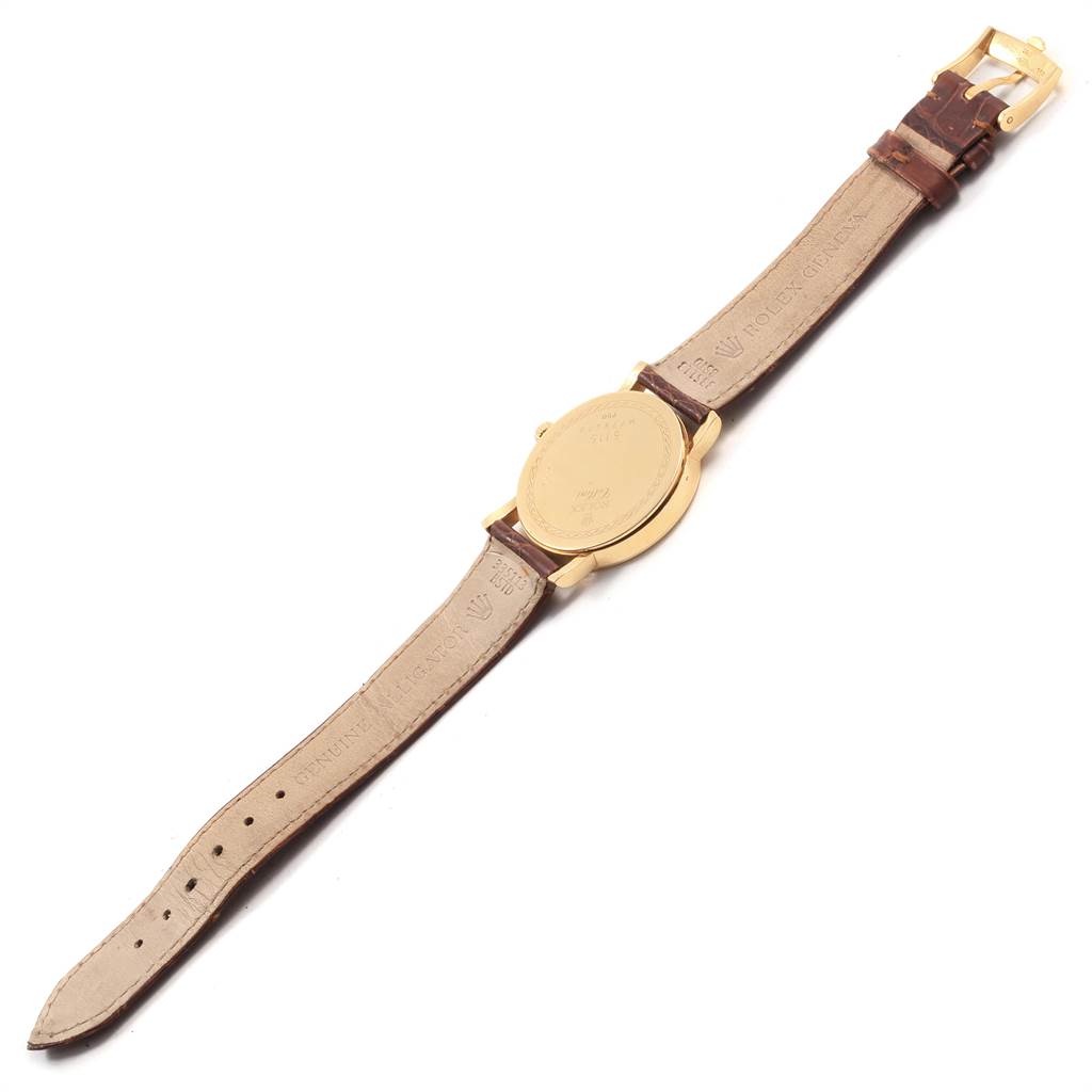 This image shows the back and strap of the Rolex Cellini 5115 Men's Yellow Gold Beige Dial 5115 Men's Yellow Gold Beige Dial watch laid flat, highlighting the leather band and buckle.