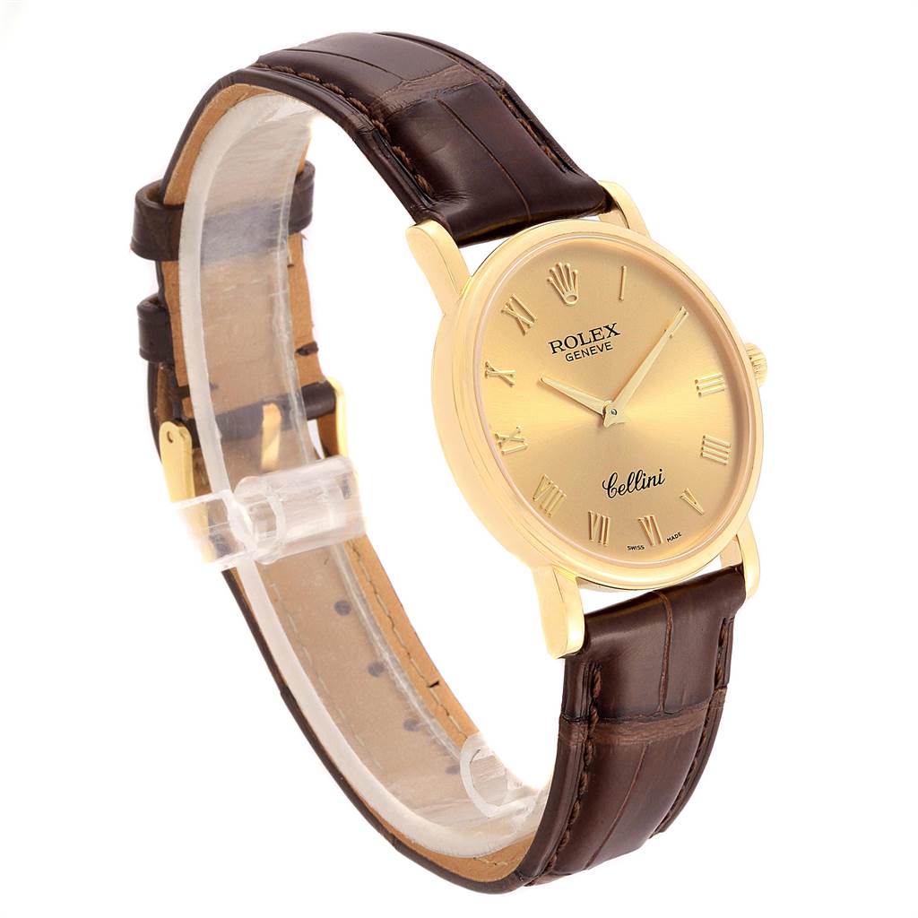 The Rolex Cellini 5115 Men's Yellow Gold Champagne Dial 5115 Men's Yellow Gold Champagne Dial watch is shown from an angled front view, displaying its brown leather strap and gold dial.