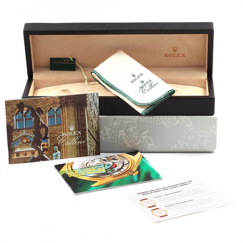 The image shows a Rolex Cellini 5115 Men's Yellow Gold Champagne Dial 5115 Men's Yellow Gold Champagne Dial watch box, cloth, and pamphlets from a front angle.