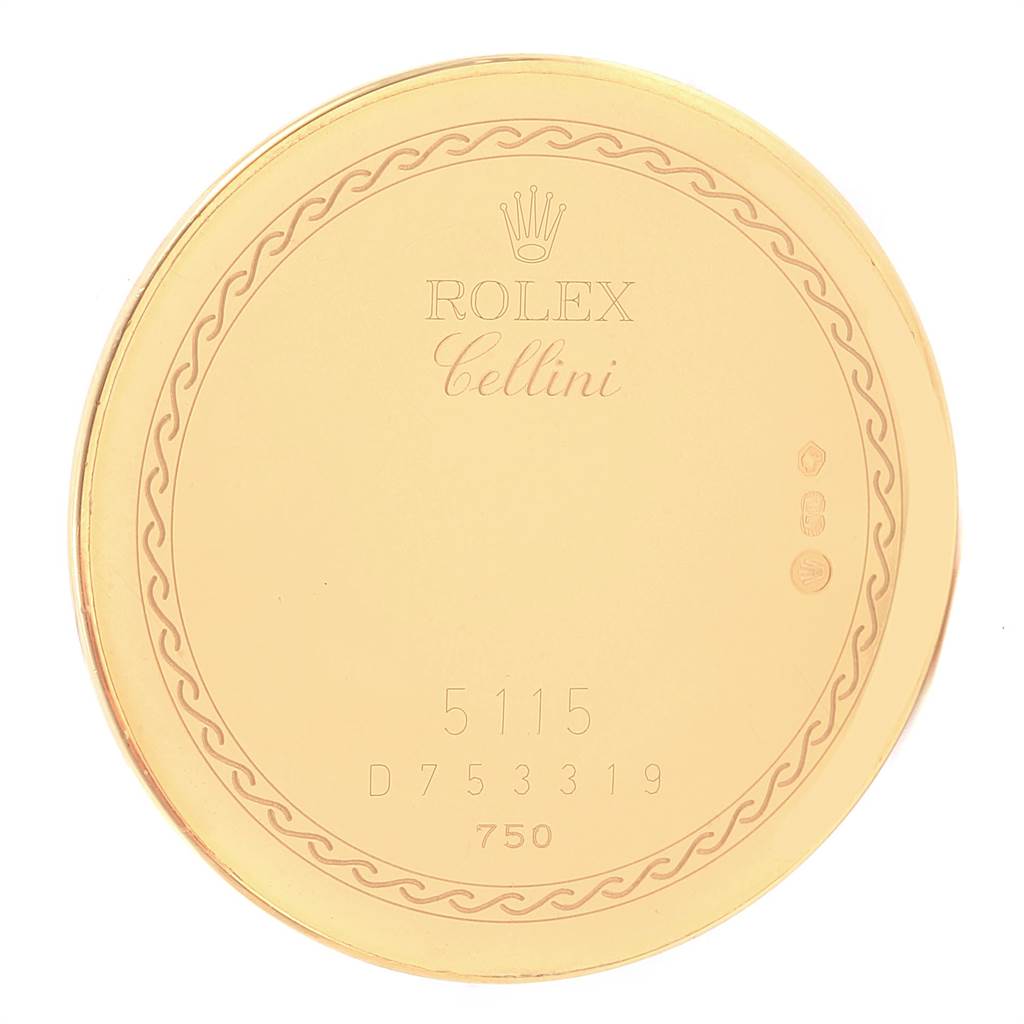 This image shows the back case of a Rolex Cellini 5115 Men's Yellow Gold Champagne Dial 5115 Men's Yellow Gold Champagne Dial model watch, with engraved branding and serial numbers.