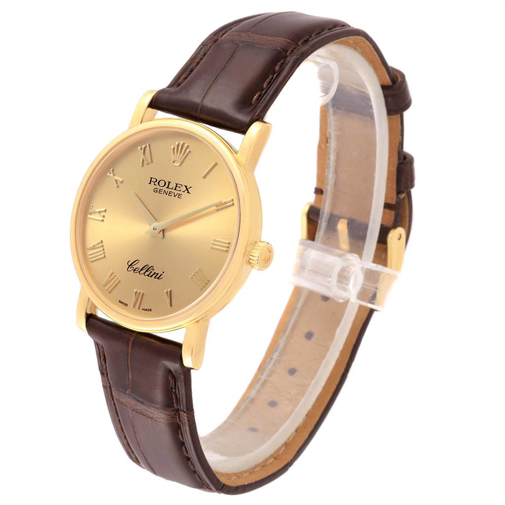 This image shows a Rolex Cellini 5115 Men's Yellow Gold Champagne Dial 5115 Men's Yellow Gold Champagne Dial watch at a three-quarter angle, highlighting the gold dial, brown leather strap, and crown.