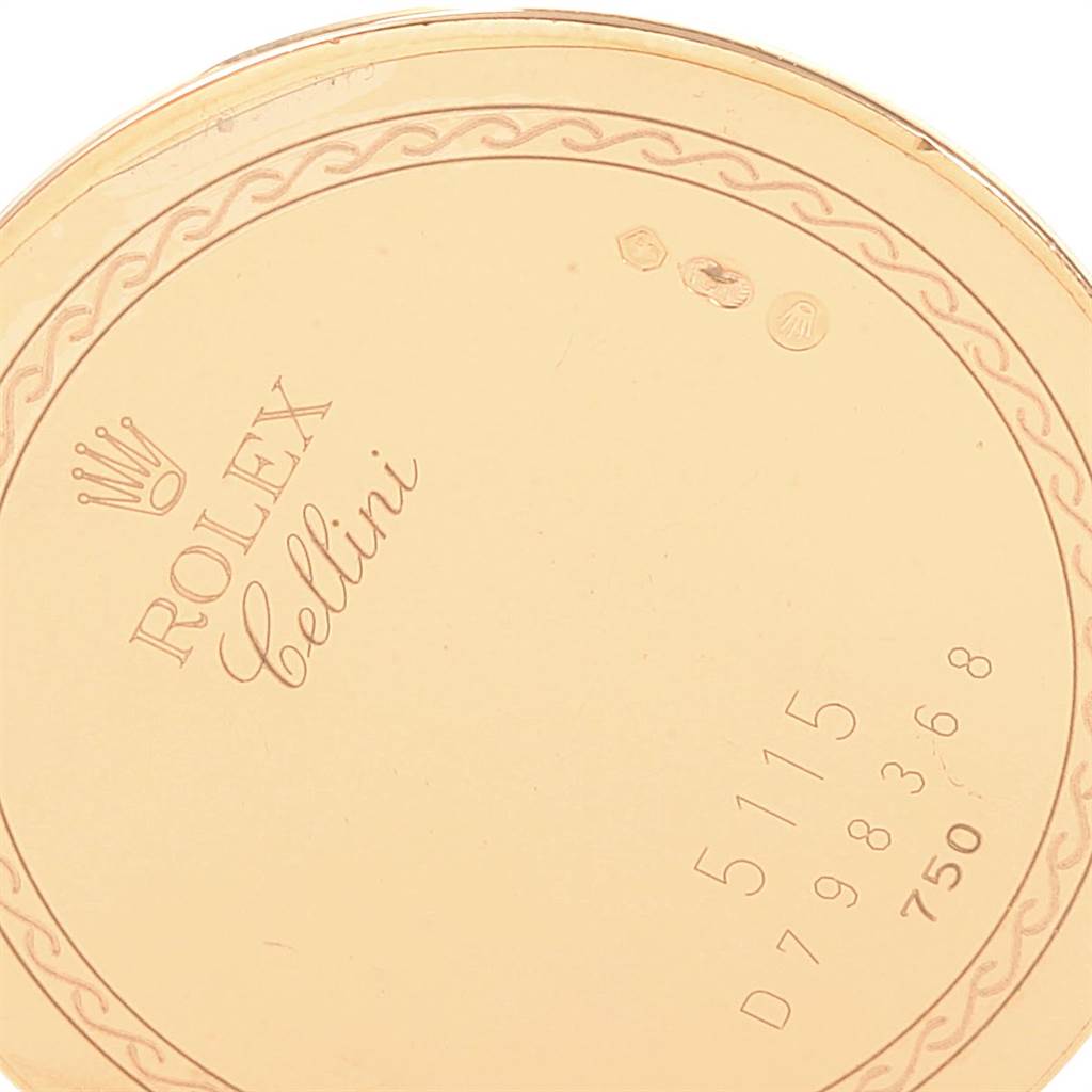 The image shows the engraved back case of a Rolex Cellini 5115 Men's Yellow Gold Beige Dial 5115 Men's Yellow Gold Beige Dial watch, featuring the brand logo, model name, and serial number.