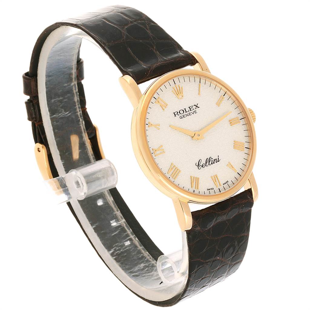 The Rolex Cellini 5115 Men's Yellow Gold Beige Dial 5115 Men's Yellow Gold Beige Dial watch is shown at a slight angle, displaying the watch face, dial, gold case, and leather strap.