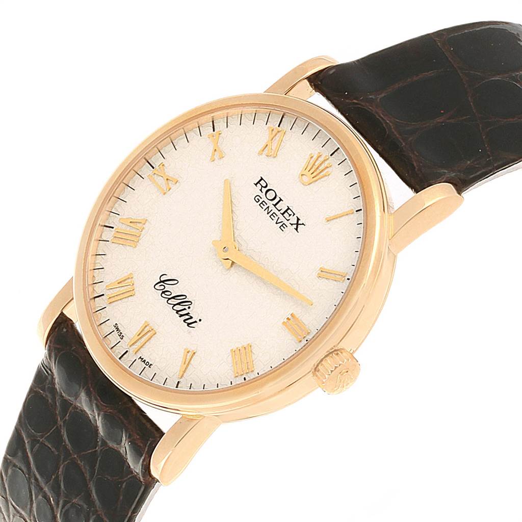 The Rolex Cellini 5115 Men's Yellow Gold Beige Dial 5115 Men's Yellow Gold Beige Dial watch is shown at an oblique angle, highlighting its dial, hands, crown, and leather strap.