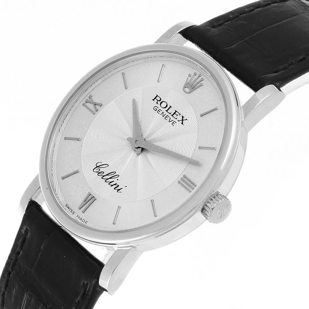 The image shows a Rolex Cellini 5115 Men
s White Gold Silver Dial 5115 Men
s White Gold Silver Dial watch at an angled side view, displaying its face, crown, and leather strap.