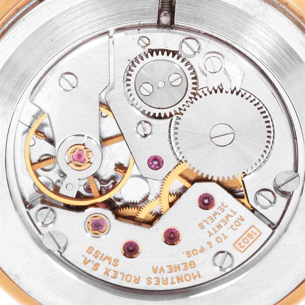 This image shows the intricate internal mechanism of the Rolex Cellini 5112 Men's Yellow Gold Beige Dial 5112 Men's Yellow Gold Beige Dial watch, highlighting gears and jewel bearings.