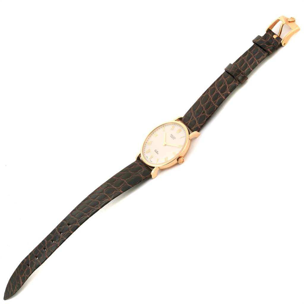 The image shows a full view of a Rolex Cellini 5112 Men's Yellow Gold Beige Dial 5112 Men's Yellow Gold Beige Dial watch laid flat, highlighting its leather strap and round dial.