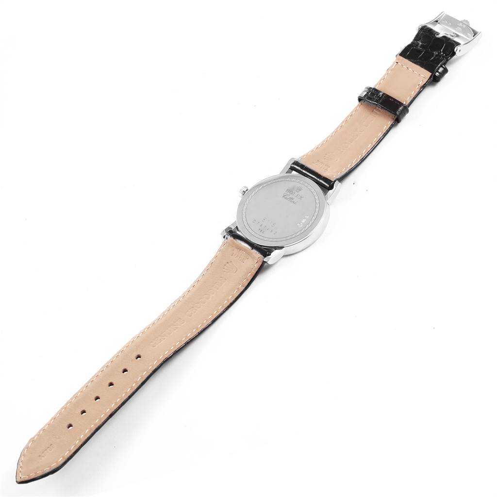 The image shows the back view of a Rolex Cellini 5115 Men
s White Gold Black Dial 5115 Men
s White Gold Black Dial watch, including the leather strap and clasp.
