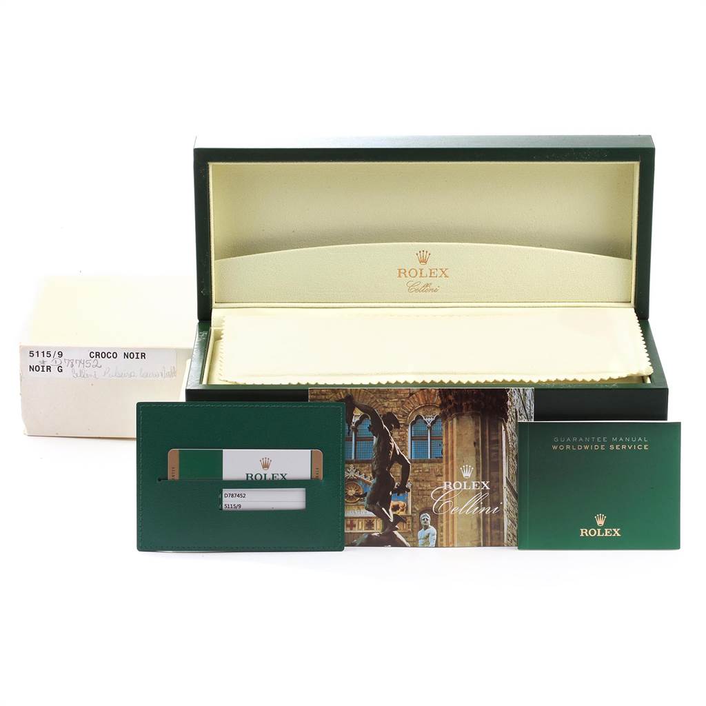 This image shows the packaging, guarantee manual, card holder, and box for a Rolex Cellini 5115 Men
s White Gold Black Dial 5115 Men
s White Gold Black Dial watch.