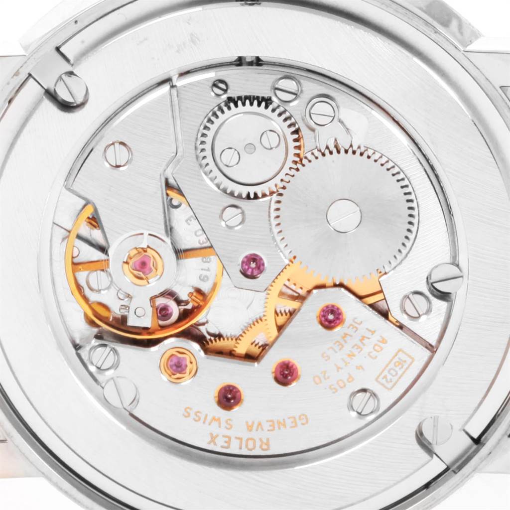 The image shows a close-up of the movement and internal gears of a Rolex Cellini 5115 Men
s White Gold Black Dial 5115 Men
s White Gold Black Dial watch from the back view.