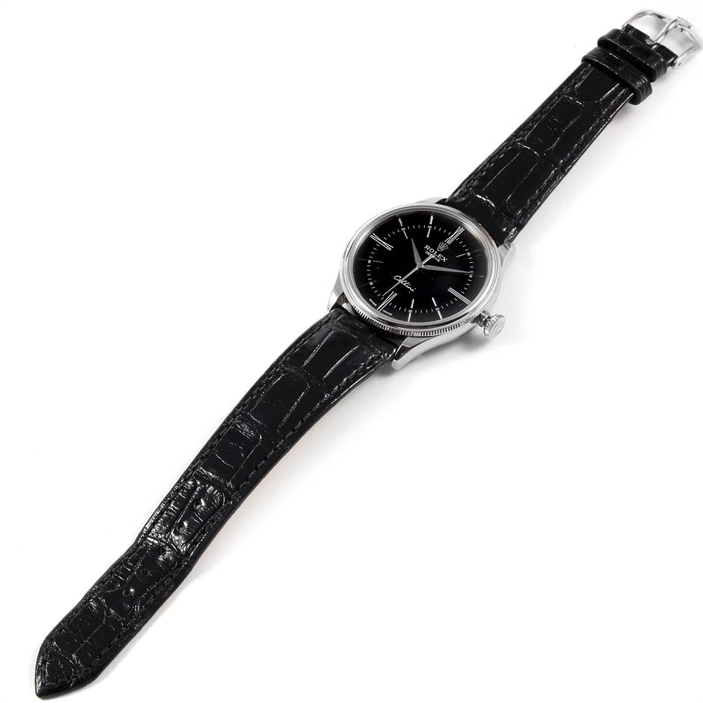 The Rolex Cellini 50509 Men's White Gold Black Dial 50509 Men's White Gold Black Dial watch is shown from above, displaying the black dial, silver case, crown, and black leather strap.