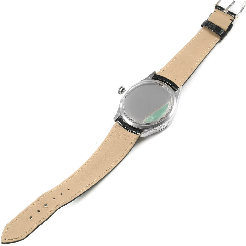 The image shows the back of a Rolex Cellini 50509 Men's White Gold Black Dial 50509 Men's White Gold Black Dial watch, including the strap and the crown.