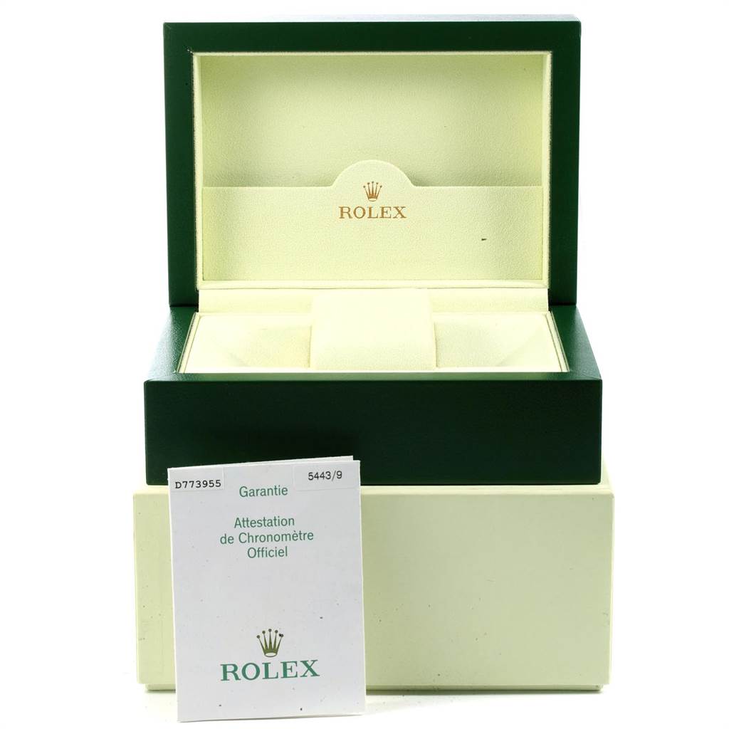 This image shows an open Rolex Cellini 5443 Men's White Gold Black Dial 5443 Men's White Gold Black Dial watch box with a warranty booklet in front of it.