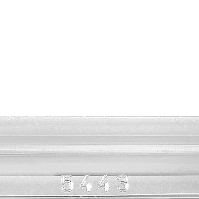 This image shows a close-up of the engraved serial number "5443" on the side of a Rolex Cellini 5443 Men's White Gold Black Dial 5443 Men's White Gold Black Dial watch case.