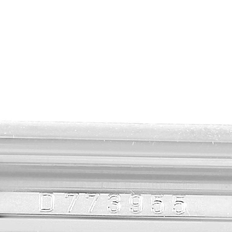 The image shows the serial number engraving on the side of the case of a Rolex Cellini 5443 Men's White Gold Black Dial 5443 Men's White Gold Black Dial watch.